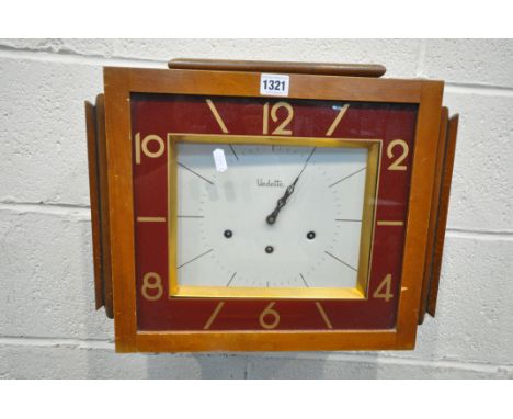 AN ART DECO WALNUT WALL CLOCK, labelled Vedette to the face, width 46cm x depth 17cm x height 35cm (condition - surface marks
