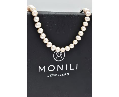 A CULTURED PEARL NECKLACE, a single strand of baroque cultured white pearls with a pink hue, forty two pearls fitted to a dou
