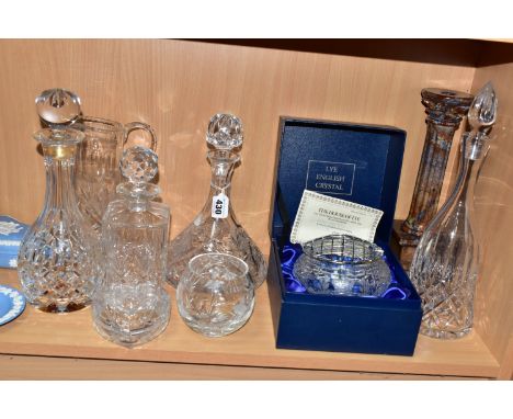 A GROUP OF CUT GLASS WARES AND A CANDLESTICK, comprising a ship's decanter height including stopper 26.6cm, a Doulton Interna