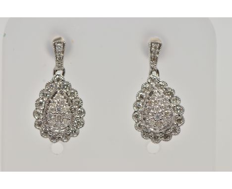 A PAIR OF 9CT WHITE GOLD DIAMOND DROP EARRINGS, each earring of a pear drop shape set with a cluster of round brilliant cut d