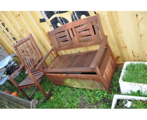 A TEAK GARDEN ROCKING CHAIR 63cm wide and a hard wood garden bench with under seat storage 121cm wide (Condition of bench woo