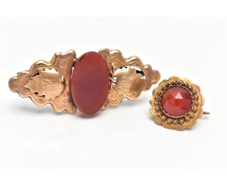 TWO YELLOW METAL LATE VICTORIAN BROOCHES, the first a small flower shape brooch set to the centre with a faceted circular cut