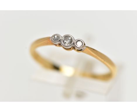 AN 18CT GOLD THREE STONE DIAMOND RING, to the centre is a collet set old cut diamond, flanked with two single cut diamonds al