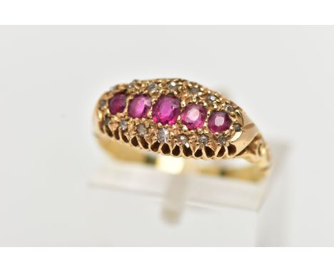 AN EARLY 20TH CENTURY, YELLOW METAL BOAT RING, set with a row of five graduated oval and circular cut rubies, in a surround o
