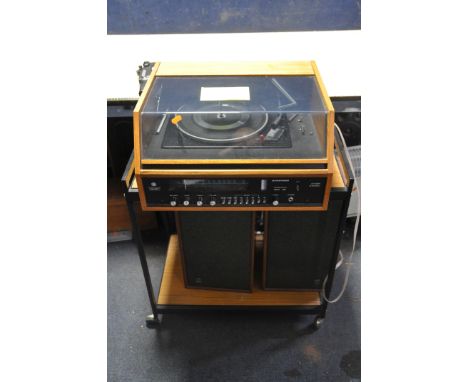 A DYNATRON SRX26 RADIO GRAM in a teak cabinet with plexi glass lid (crack to Tuner glass) a pair of LS1424 speakers and a met