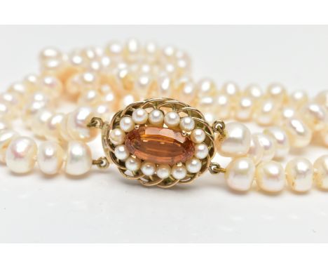 A CULTURED BAROQUE PEARL CHOKER NECKLACE, designed with two rows of baroque cultured pearls, measuring between 8-9mm each, wh