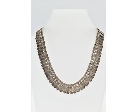 A VICTORIAN WHITE METAL FRINGE CHAIN, designed as a series of floral detailed oval links, fitted with a large bolt clasp, unm