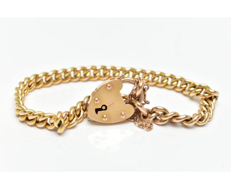 A YELLOW METAL CURB LINK BRACELET, hollow curb links, '15' stamped tag to one link, fitted with a heart padlock clasp unmarke