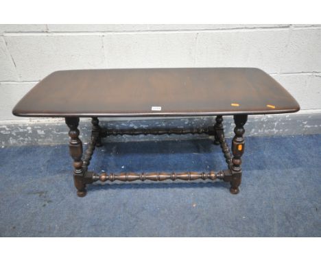 A DARK ERCOL COFFEE TABLE, length 105cm x depth 46cm x height 46cm