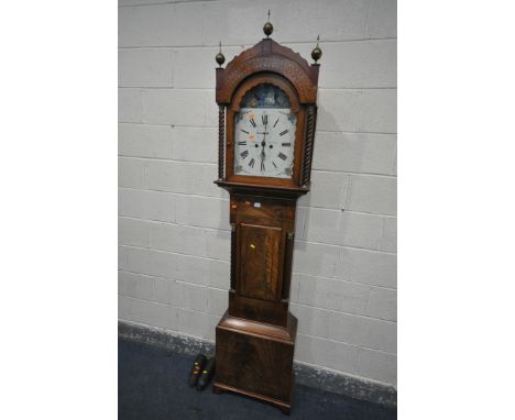 A GEORGE III MAHOGANY EIGHT DAY LONGCASE CLOCK, the hood with triple brass finials, barley twist Corinthian pillars flanking 