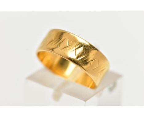 A 22CT YELLOW GOLD WIDE BAND RING, worn textured design all round, approximate band width 6.5mm, hallmarked 22ct Birmingham, 