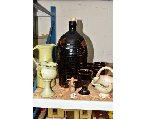 A GROUP OF STUDIO POTTERY, to include a brown glazed cider flagon, height 44cm, with four matching goblets, flagon is marked 