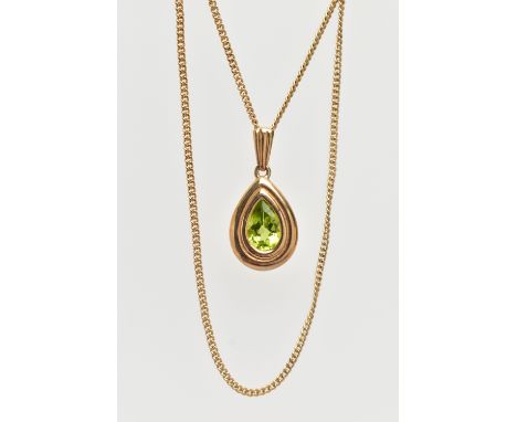 A 9CT GOLD PERIDOT PENDANT NECKLACE, the pendant of a pear drop shape, collet and claw set pear cut peridot, fitted with a ta