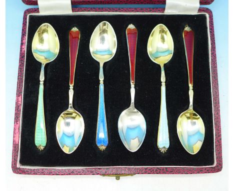 Six silver and enamel spoons, cased, three Walker &amp; Hall, (red), and three Adie Bros., matched set, one with enamel on th