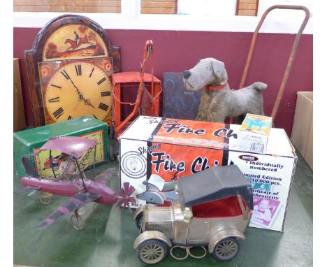 A box of vintage toys including a die-cast Fire Chief Engine, boxed, crane and push along dog walker