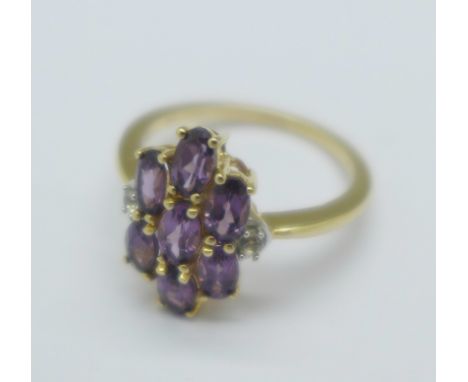 A 9ct gold and amethyst cluster ring, 2.6g, L