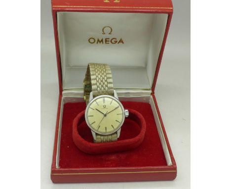 A gentleman's Omega wristwatch, boxed, with replacement button