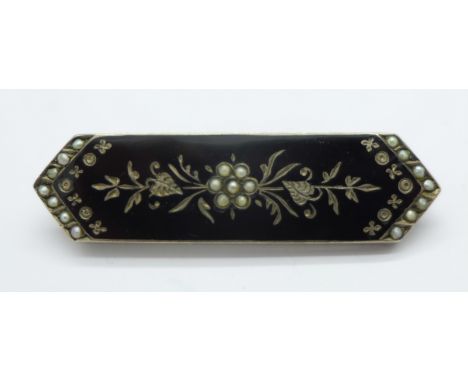 A Victorian black enamel and seed pearl mourning brooch