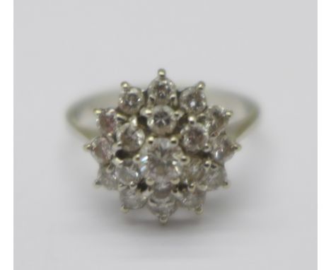 An 18ct white gold and diamond cluster ring, diamond weight approximately 0.8ct, colour G-1, clarity SI1/SI2, total weight 2.