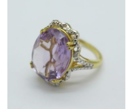 A silver gilt, amethyst and diamond ring, R