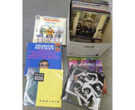 A collection of LP records and 7" vinyl singles, including George Harrison All Things Must Pass box set with poster, The Beat