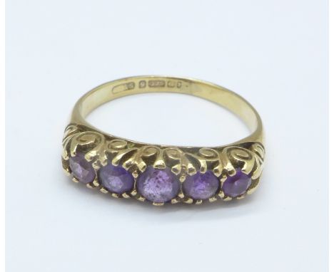 A 9ct gold and amethyst five stone ring, 2g, M