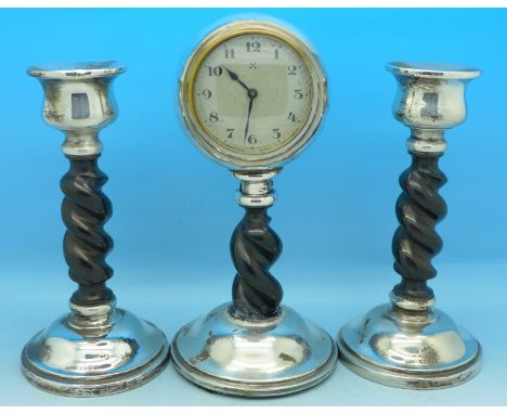A silver mounted clock and candlestick set, Chester 1928, height of clock 17.5cm