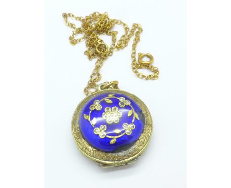A yellow metal, enamel and seed pearl locket/pendant on a yellow metal chain, a/f