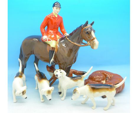 A Beswick huntsman, four hounds, fox and a lying fox, (7), two hounds a/f