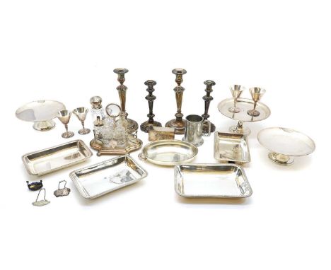 A collection of silver plated items, to include a pair of candlesticks, with scrolled foliate bases, 26cm high, a pair of sma