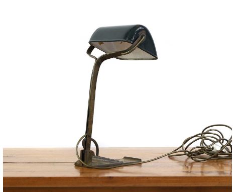A Horax table lamp, 1920s, the green enamelled visor shade raised on an articulating cast iron stem, terminating onto a stepp