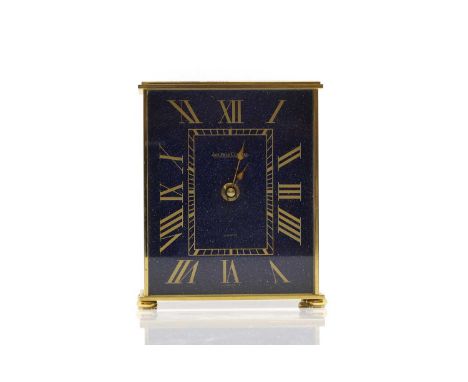 A Jaeger le Coultre brass mantel clock, the lapis lazuli face is Roman numerals, stamped 'Swiss 5554',13cm wide7cm deep16cm h