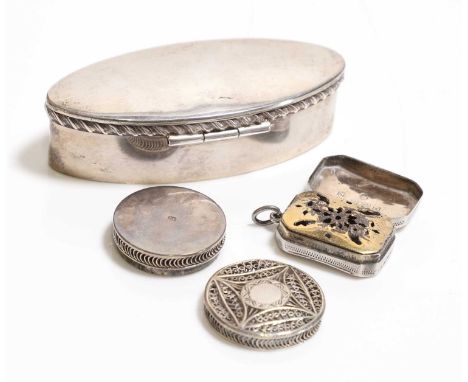 A silver box Chester 1903, of oval form, 7.5cm widetogether with a silver filagree patch box, 2.5cm diameterand a George III 