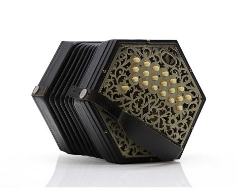 An ebonised concertina, early 20th century, of hexagonal form, each side with a pieced silver plated mounts with filigree pat