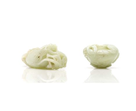 Two Chinese jade water pots, 20th century, comprising:one in the shape of a lotus leaf, surrounded with lotus flowers and see