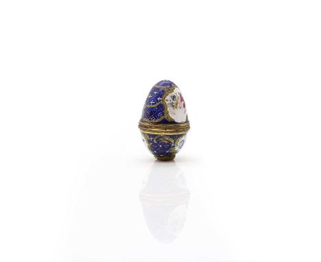 A Bilston enamel egg-shaped nutmeg grater, 18th century, with a blue ground, with gilt panels painted with flowers, 4.8cm hig