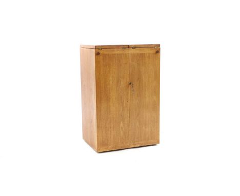 A Heals folding drinks cabinet with a fold out top, opening into two sections, the fitted interior with two Danish stainless 