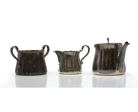 A silver three piece tea service by Garrard &amp; Co Ltd, London 1919, comprising a teapot, twin-handled sugar jug, and a cre