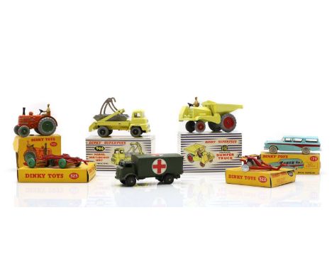 A collection of Dinky die cast toys all boxed, comprising a Field-Marshall tractor, 301, a triple gang mower, 323, a disc har