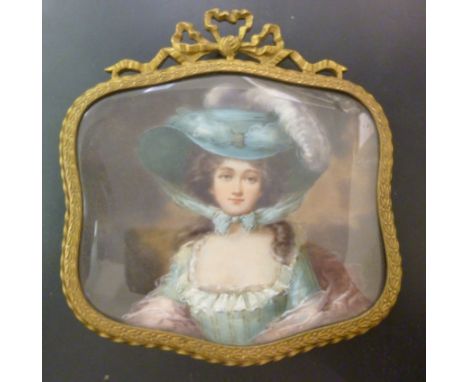 A 19thC head and shoulders portrait miniature, a Gainsborough lady, wearing a plumed bonnet, in a glazed shield shaped gilt m