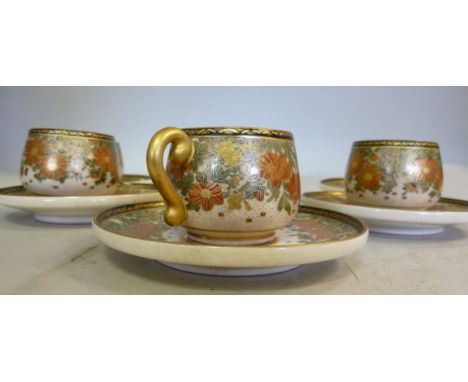 A set of six early 20thC Satsuma earthenware coffee cups and saucers, traditionally decorated with dense flora and gilding  b