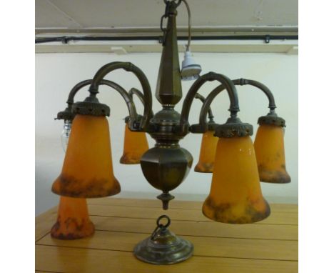 An Art Deco anodised brass chandelier, having six scrolled branches and Muller, Fres. Luneville opaque, streaky orange glass,