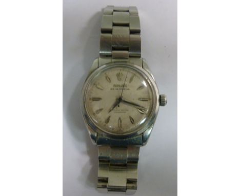 A Rolex stainless steel cased Oyster Perpetual bracelet wristwatch, faced by a baton dial and inscribed 'Officially Certified