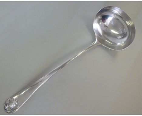 A silver shell pattern soup ladle  Mappin & Webb  Sheffield 1911  