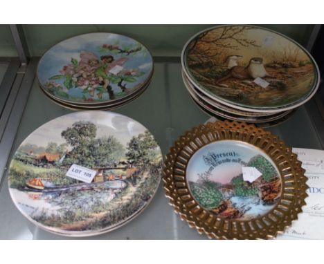 A shelf containing a good selection of collectors plates some with certificates