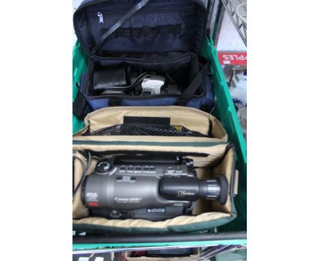 A box containing a Cannon UC9 camcorder and a Cannon EOS 500 camera in original cases