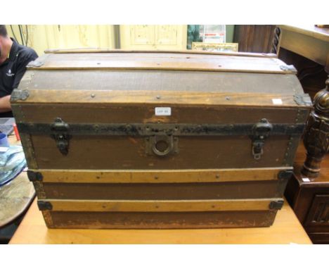 A domed top steamer trunk