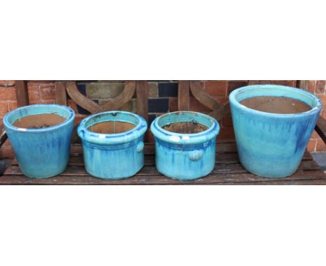 Four blue glazed ceramic planters
