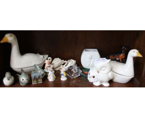 A selection of ceramic figurines to include two geese, a dog, swans and fish etc