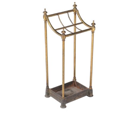  A Victorian brass stick stand  , circa 1870, the turned finials and shaped top incorporating six divisions above stem suppor